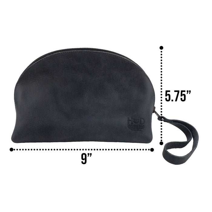 Dimensions and features of the Accessory Pouch Organizer Hand Bag by Hide & Drink, highlighting its functional design in black full grain leather. This Cosmetic Travel Organizer with Hand Strap for Women is also a reliable Makeup Bag and Classic Handbag, showcasing artisan quality from La Antigua Guatemala & Oaxaca Mexico.