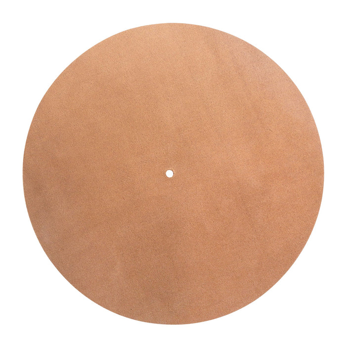 Image showcasing the underside of the Circular Turntable Slipmat by tocame, revealing the minimalist design in soft leather. This slipmat serves as an antistatic cover, reducing noise from dust and static while enhancing your vinyl experience. Handmade in La Antigua Guatemala, it features hand cut and hand sewn craftsmanship.