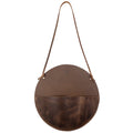 Leather At Home Circular Wall Hanger, a stylish and functional wall file organizer in full grain leather. Perfect for storing documents, letters, invoices, and envelopes. Handmade in La Antigua Guatemala, showcasing artisan craftsmanship with small batch production techniques.
