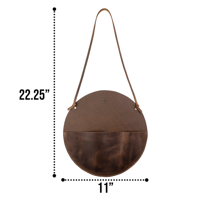 Dimension view of the Leather At Home Circular Wall Hanger, highlighting its useful size. Made from durable full grain leather, this wall file organizer exemplifies small batch production and artisan craftsmanship from La Antigua Guatemala.