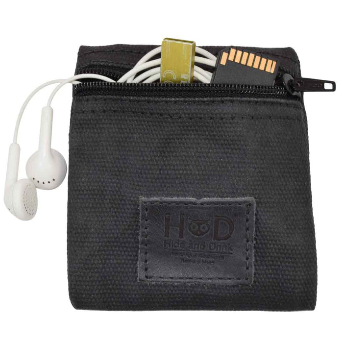 Hide & Drink Condom Pouch with a blue condom, featuring durable water resistant waxed canvas. This multifunctional pocket purse is a practical classic partner gift ideal for travel. Handmade in La Antigua Guatemala ensures quality artisan production.