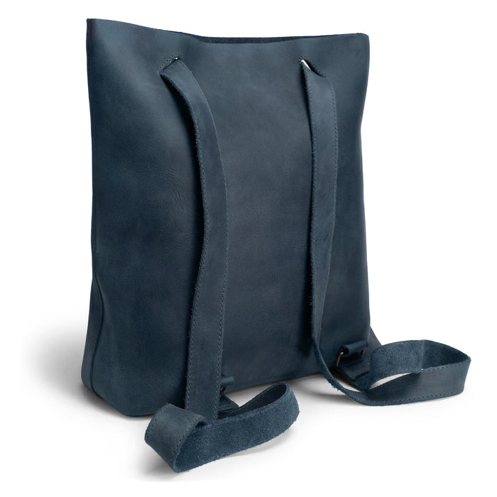 Back view of Heather's Convertible Backpack to Shoulder Bag, highlighting adjustable straps and the quality of Full Grain Leather. This stylish, spacious crossbody for women is a testament to small batch production, hand cut, hand sewn, and fire branded by artisans in La Antigua Guatemala & Oaxaca Mexico.