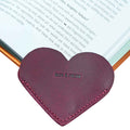 View of a burgundy Leather Corner Heart Bookmark (2 pack) by Hide & Drink, crafted with Full Grain Leather for a premium feel. This artisan product is handcrafted in La Antigua Guatemala and Oaxaca Mexico, emphasizing attention to detail.