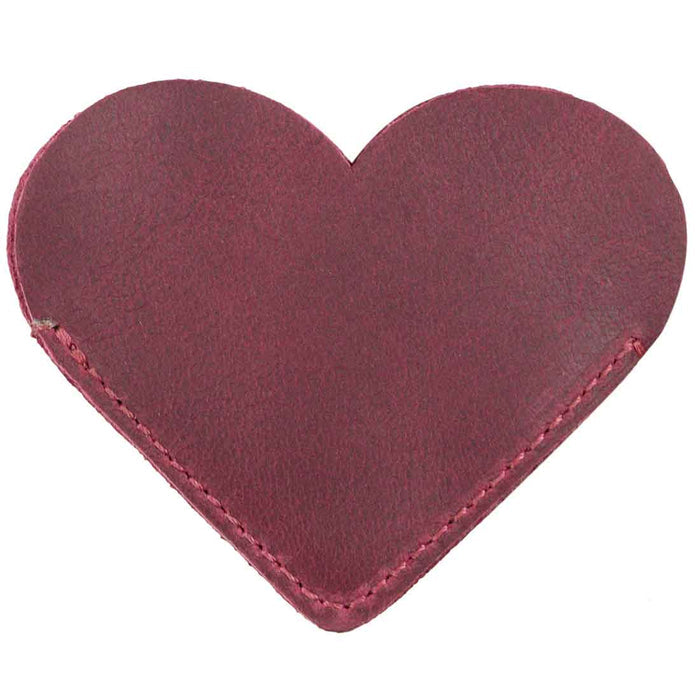 Two burgundy Leather Corner Heart Bookmarks (2 pack) by Hide & Drink, highlighting unique styles crafted from Full Grain Leather. This product reflects the artisan craftsmanship of La Antigua Guatemala and Oaxaca Mexico, showcasing small batch production.