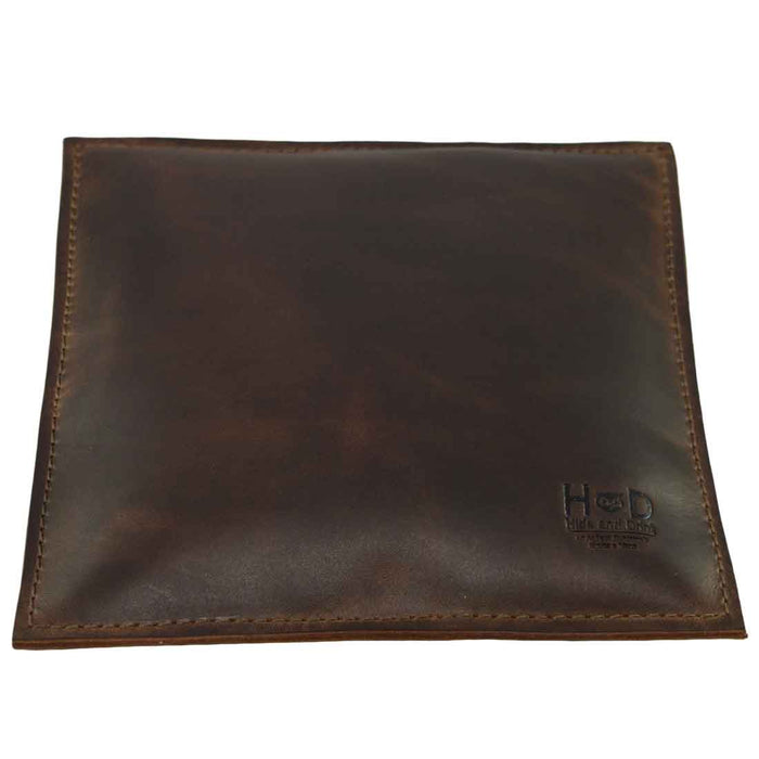 Elegant Hide & Drink Decorative Pillow, a 12 x 12 in. accessory crafted from full grain leather, perfect for adding stylish decor to your couch, sofa, or bed. This pillow is part of small batch production, hand cut, hand sewn and fire branded, made by artisans in La Antigua Guatemala & Oaxaca Mexico.