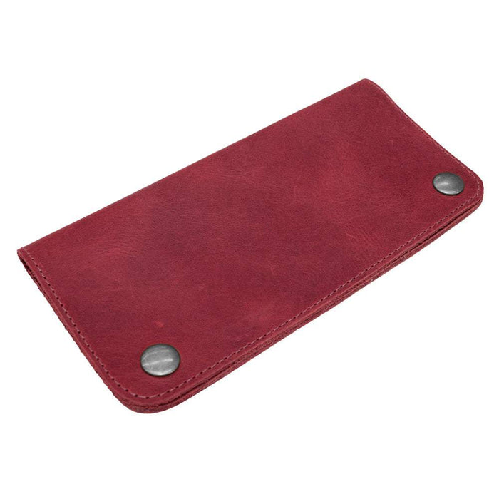 Showcasing the Red Double Snap Folio Wallet by Hide & Drink, a vibrant and stylish full grain leather holder designed for cash and cards. This rectangular flat bill holder with card slot acts as an ideal night bag and travel accessory, showcasing the artisan craftsmanship from La Antigua Guatemala & Oaxaca Mexico.