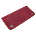 Showcasing the Red Double Snap Folio Wallet by Hide & Drink, a vibrant and stylish full grain leather holder designed for cash and cards. This rectangular flat bill holder with card slot acts as an ideal night bag and travel accessory, showcasing the artisan craftsmanship from La Antigua Guatemala & Oaxaca Mexico.