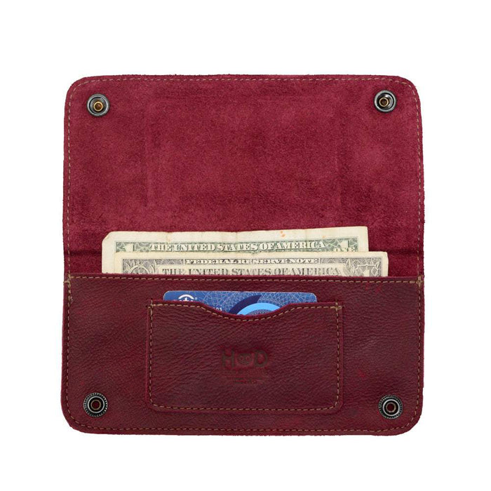 Inside view of the Red Double Snap Folio Wallet by Hide & Drink, featuring compartments for cash and cards. This full grain leather piece serves as a practical rectangular flat bill holder with card slot, perfect as a night bag or travel accessory. Handcrafted with care in La Antigua Guatemala & Oaxaca Mexico.