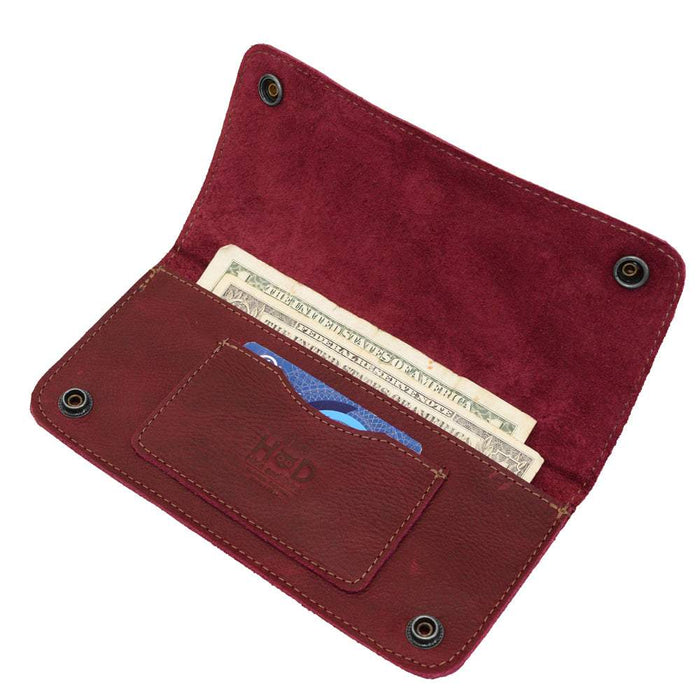 Open view of the Red Double Snap Folio Wallet by Hide & Drink, showcasing its design for secure cash and card storage. This full grain leather wallet is a stylish rectangular flat bill holder with card slot, ideal for use as a night bag or travel accessory, artisan crafted in La Antigua Guatemala & Oaxaca Mexico.