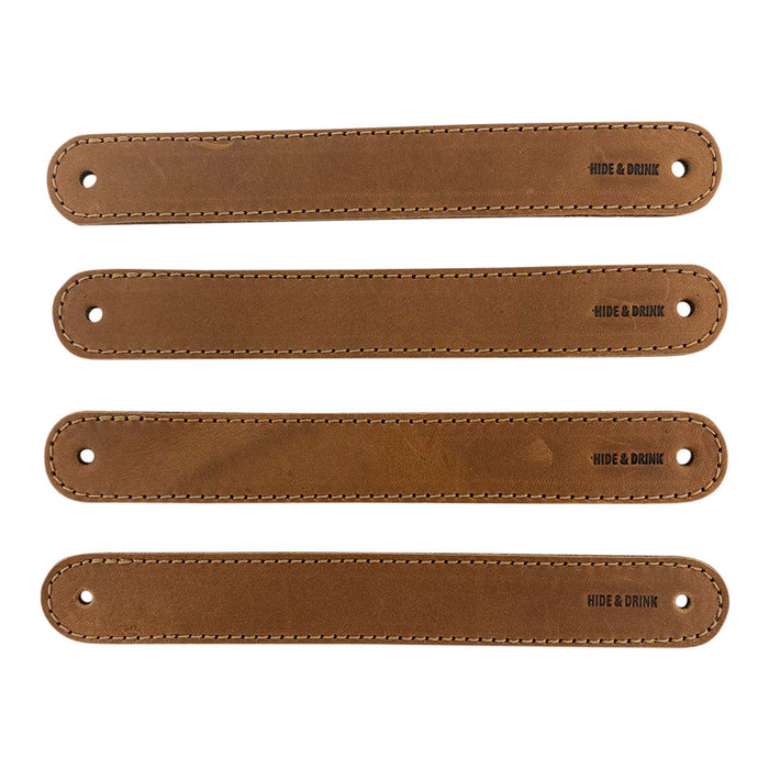 Hide & Drink Drawer Handles (4pk) featuring a close-up of light-colored leather handles, perfect for DIY projects. Durable, versatile, and artisan crafted with pre-made holes for easy installation.