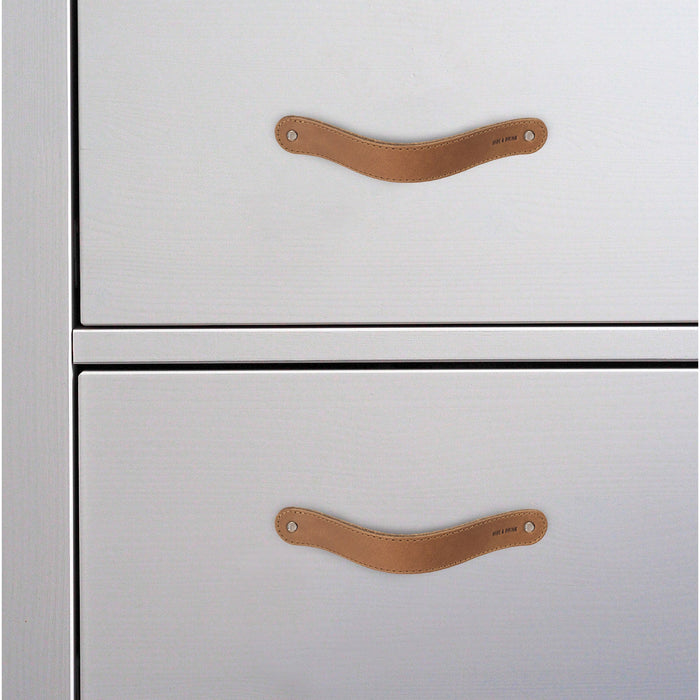 Hide & Drink Drawer Handles (4pk) featuring four beautifully crafted leather handles, ideal for various home projects. Durable and easy to install, each piece reflects artisan craftsmanship.
