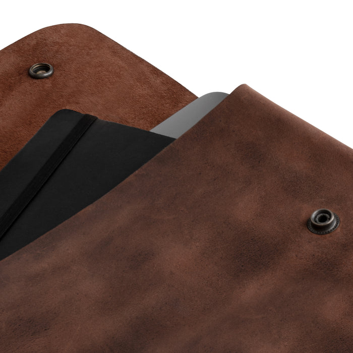 Close-up of the Leather Worx Folder Document Holder, highlighting its exquisite full grain leather texture. This vintage folder document holder is ideal for those needing a stylish document portfolio or binder strapless carry on bag, perfect for any office or work setup. Crafted in La Antigua Guatemala, it features hand sewn and hand cut craftsmanship, representing small batch production and artisan dedication.