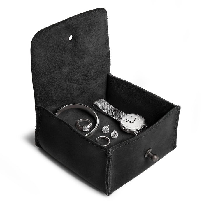 Interior shot of a Hide & Drink Jewelry Pouch with rings stored inside, designed for organized precious items. This artisan pouch captures the essence of upscale gifting for weddings.