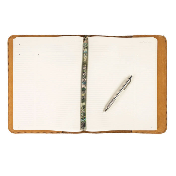 The interior design of the Journal Cover for (8.5 x 11 in.) Moleskine Cahier XXL from Hide & Drink, featuring its handmade craftsmanship in luxurious full grain leather. The perfect accessory for writers who appreciate quality materials sourced from La Antigua Guatemala & Oaxaca Mexico.