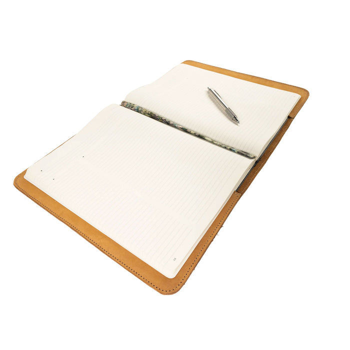 The Journal Cover for (8.5 x 11 in.) Moleskine Cahier XXL shown in a semi-open position by Hide & Drink, highlighting its artisan-crafted full grain leather appeal. A perfect combination of form and function, proudly created in La Antigua Guatemala & Oaxaca Mexico.