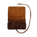Handcrafted King Size Tobacco Pouch by Hide & Drink made from high-quality Full Grain Leather, serving as a rustic Field Notes Case. This vintage storage solution is perfect for your accessories, embodying small batch production and artisan craftsmanship from La Antigua Guatemala and Oaxaca Mexico.