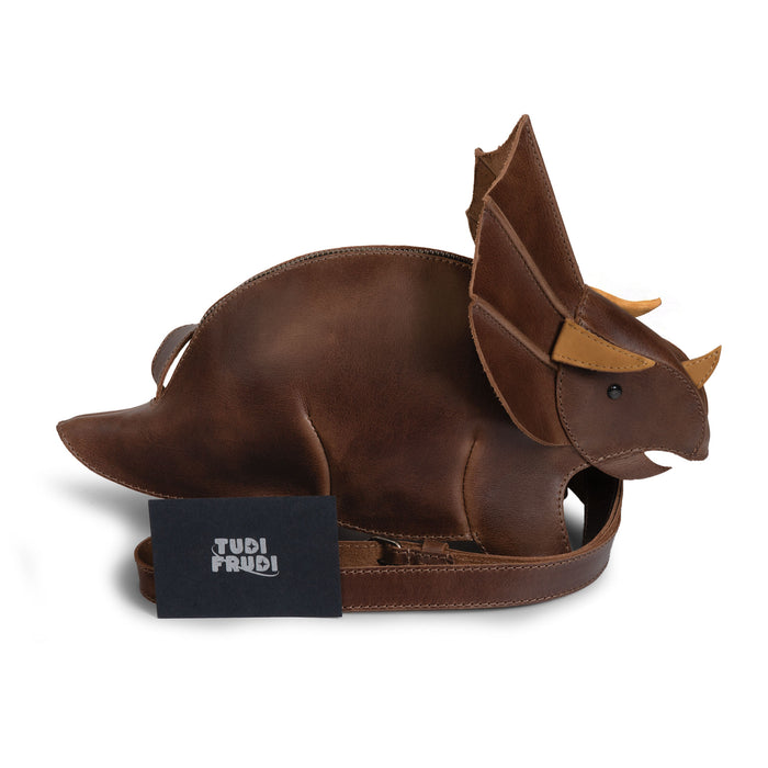 Tudi Frudi Leather Dinosaur Triceratops Shoulder Bag with adjustable strap and size measurements shown, made from Full Grain Leather through StockyardX Small Batch Production, Hand Cut, Hand Sewn, Fire Branded Artisan craftsmanship, Handmade in La Antigua Guatemala & Oaxaca Mexico.