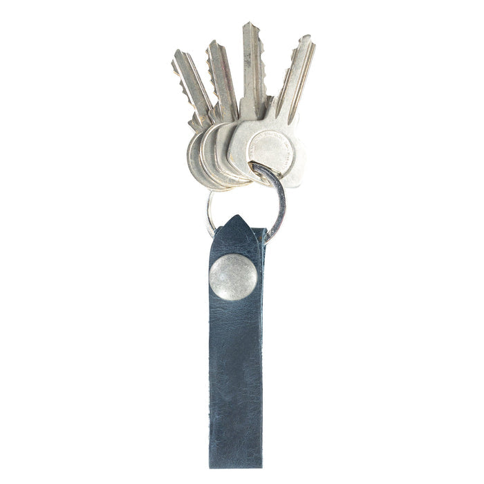 Hide & Drink Loop Keychain featuring a classic navy design perfect for key organization. This rustic keychain with belt loop is handmade from full grain leather by artisans in La Antigua Guatemala & Oaxaca Mexico.