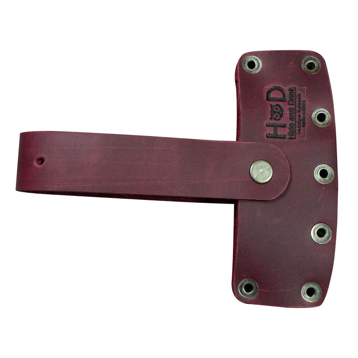 The Hide & Drink Lumberjack Axe Sheath featuring an adjustable strap for utility and style. Made from durable full grain leather, this rustic protector holster reflects small batch artisan craftsmanship.