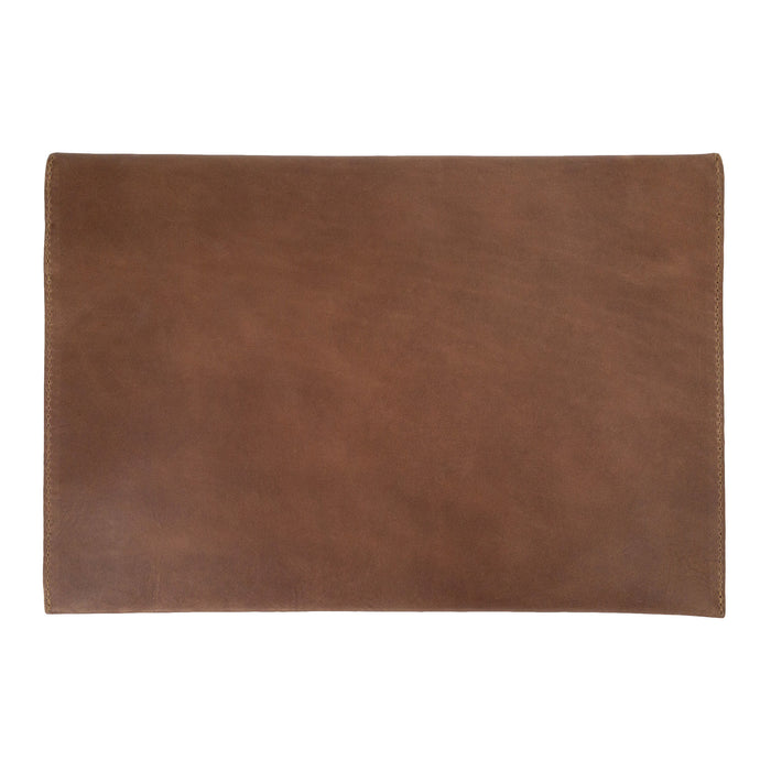 Elegant design of the Hide & Drink MacBook Slim Case showcasing the leather tag, perfect for personalization. This case is compatible with MacBook Air/Pro 13 Inch with M1 Chip, highlighting artisan craftsmanship through its hand cut, hand sewn production.