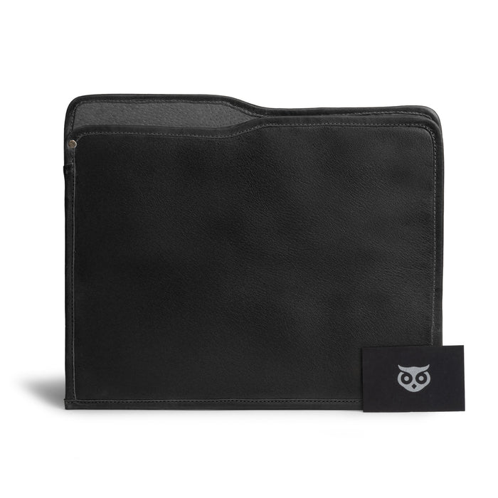 A stylish Manila Folder by Hide & Drink shown with documents, exemplifying its function as a Document Holder. This Full Grain Leather accessory highlights dedicated Small Batch Production and artisan craftsmanship from La Antigua Guatemala and Oaxaca Mexico.