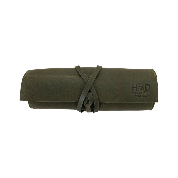 Hide & Drink Multi Purpose Pencil Roll in a display showcasing its versatile features and sturdy leather craftsmanship. This handmade organizer is perfect for storing scissors, earphones, and more, combining functionality with rustic style.