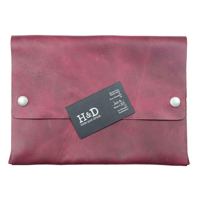 Hide & Drink's red Multipurpose Portfolio with a business card, highlighting its sophisticated design and Full Grain Leather quality for carrying essentials. Artisan made in La Antigua Guatemala & Oaxaca Mexico for durability.