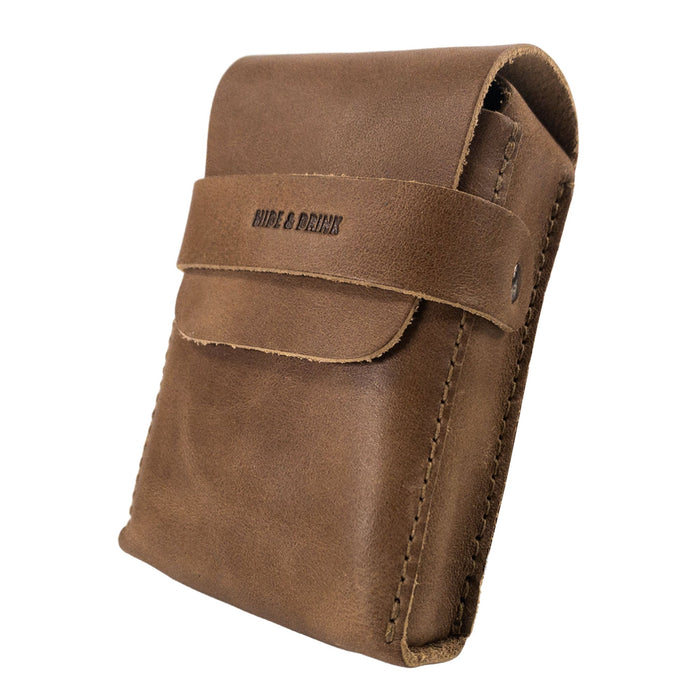 Side view of Hide & Drink's brown Playing Card Case, highlighting its sleek design. This stylish accessory serves as a classic case for playing cards (not included), made from quality full grain leather. Artisan crafted by StockyardX, it promises durability and elegance.