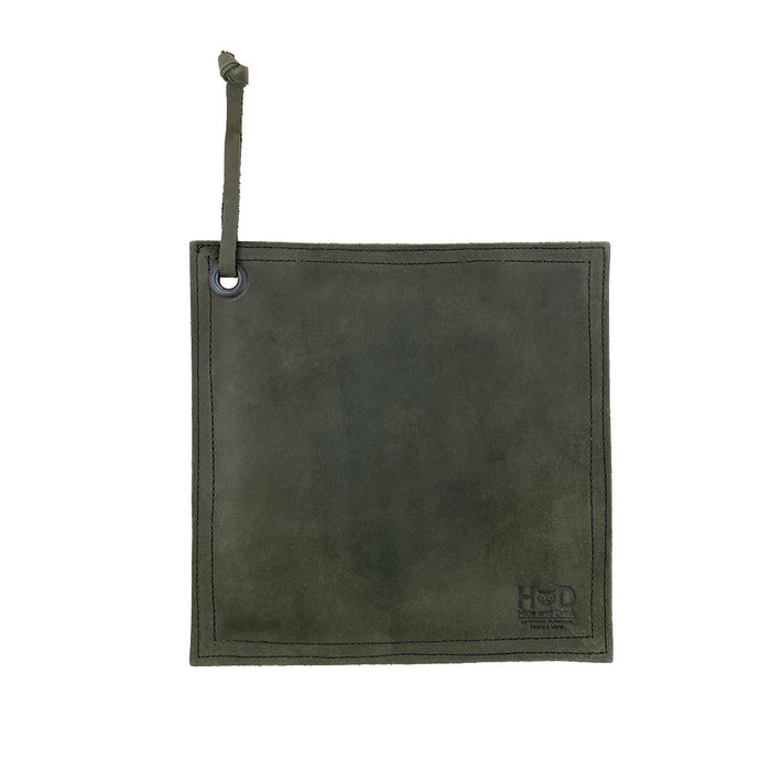 Hide & Drink Pot Pad in deep blue leather, showcasing its artisan craftsmanship. Perfect for protecting surfaces from hot items, it combines practicality with style.