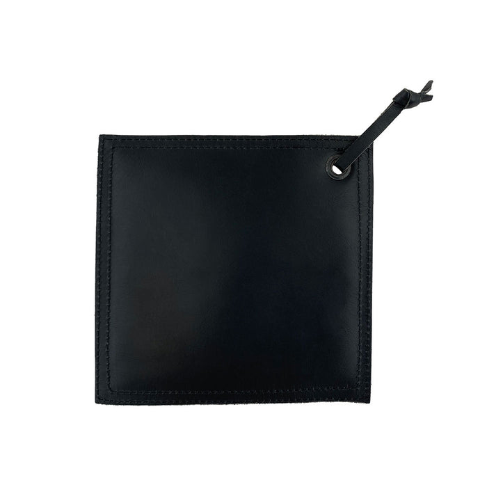 Back view of the Hide & Drink Pot Pad in darker brown leather, showing it’s handcrafted nature. Ideal for holding hot items, this double-layered pot pad is both functional and stylish.