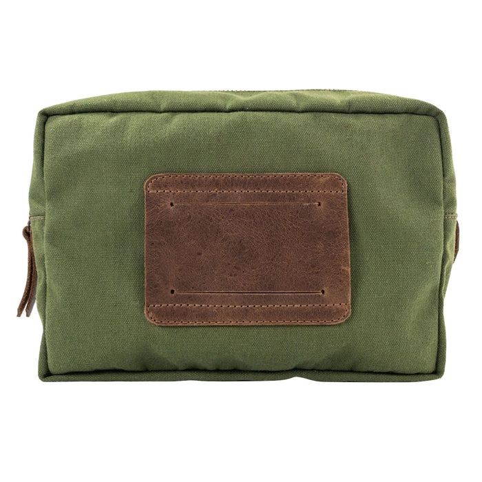 Back view of the Rectangular Utility Bag for Camping by Valhalla Gear, featuring a leather patch and sturdy design, made from water-resistant canvas and full grain leather, artisan-crafted in La Antigua Guatemala.