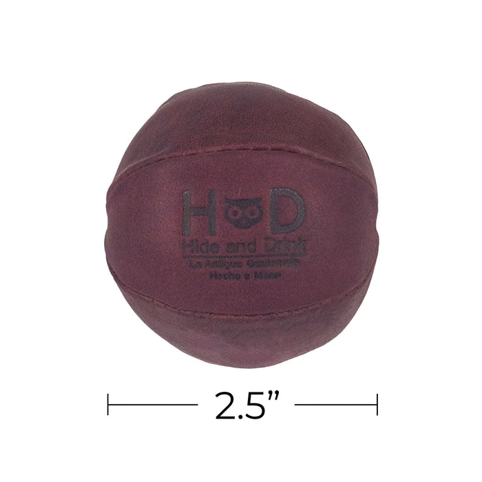 Hide & Drink maroon Stress Ball dimensions emphasized, showcasing its practical size for ease of use. Great for relieving fidgeting and anxiety with classic design, handmade from full grain leather in La Antigua Guatemala.