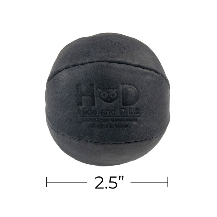 Hide & Drink black Stress Ball dimensions displayed, emphasizing its compact size of 2.5 inches for easy handling. Perfect for relieving fidgeting and anxiety, handcrafted from full grain leather in La Antigua Guatemala.