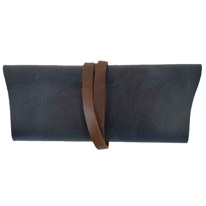 Hide & Drink Sunglass Wrap features a chic leather design that safely stores sunglasses. This eye glasses storage solution, made with full grain leather, is ideal for travel and reflects the artistry of small batch production.