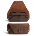 A stylish Sunglasses Sleeve by Hide & Drink, showcasing a minimalist sleeve case protector for eyewear. Crafted from full grain leather, this artisan handmade piece is perfect for protecting sunglasses while being great for outdoors and traveling. Features include small batch production, hand cut and hand sewn details, and fire branded nuances, highlighting the craftsmanship from La Antigua Guatemala.