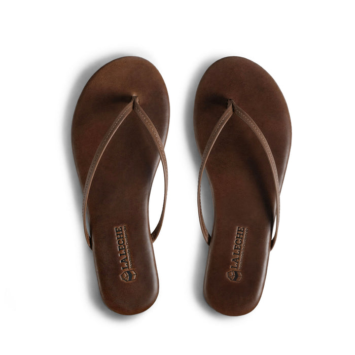 Top view of La Leche The Solana Leather Flip Flop (Women's) in brown full grain leather, featuring a slim thong design; The Solana Leather Flip Flop (Women's), Full Grain Leather, StockyardX, Small Batch Production, Hand Cut, Hand Sewn, Fire Branded, Artisan, Handmade in La Antigua Guatemala & Oaxaca Mexico.