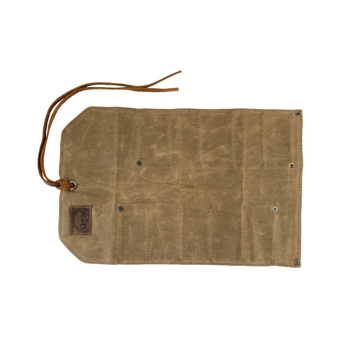 Hide & Drink Tool Roll presents a classic small tool roll-up bag with 10 slots, made from robust full grain leather. This portable carry-on pouch is great for organizing woodworking tools, fitting seamlessly into your workshop storage needs. Each artisan product is hand sewn and crafted in La Antigua Guatemala & Oaxaca Mexico.