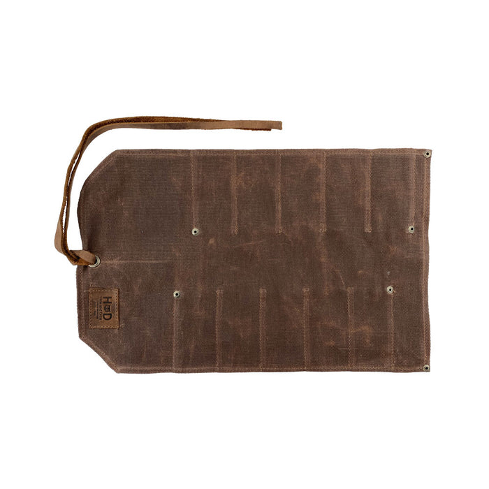 Hide & Drink Tool Roll features a classic small tool roll-up bag with 10 slots, crafted from durable full grain leather. Ideal as a portable carry-on pouch for organizing woodworking tools, enhancing your workshop storage solutions. Each piece is hand cut and sewn with care in La Antigua Guatemala & Oaxaca Mexico.