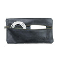 Hide & Drink Utility Cord Pouch giving a view of its practical zipper and elegant finish. This pouch serves as a great utility & charger case for MacBook, iPad & Laptop and excels as a cable organizer, reflecting artisan quality made in La Antigua Guatemala & Oaxaca Mexico.