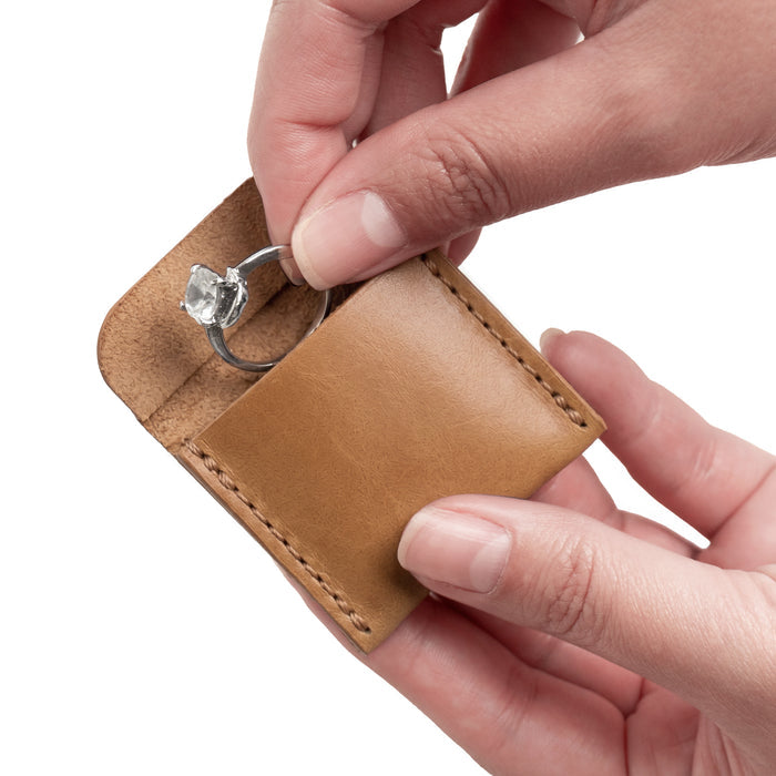 Beautifully crafted Hide & Drink Wedding Ring Case in soft full grain leather, providing an elegant way to store engagement rings. Ideal for travel and as a pouch organizer for jewelry, hand stitched with attention to detail by artisans in La Antigua Guatemala & Oaxaca Mexico.