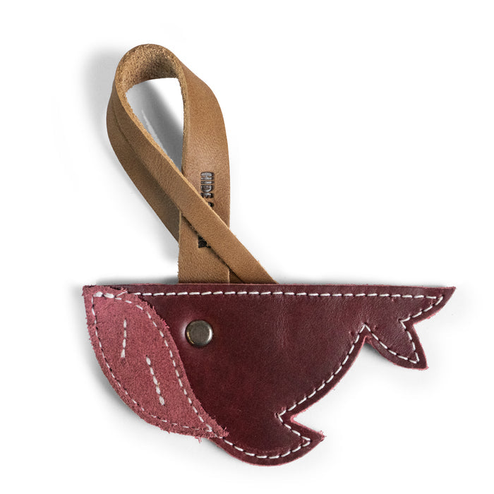 Close-up of the Whale Bag Charm by Hide & Drink, a unique accessory perfect for handbags and totes. This Whale Bag Charm for Handbags is crafted from full grain leather, showcasing artisan handmade quality. It’s an ideal Purse Charm for Tote & Backpacks, designed to be an ornament for women who appreciate stylish, durable accents. The charm is fire branded and created through small batch production in La Antigua Guatemala & Oaxaca Mexico.