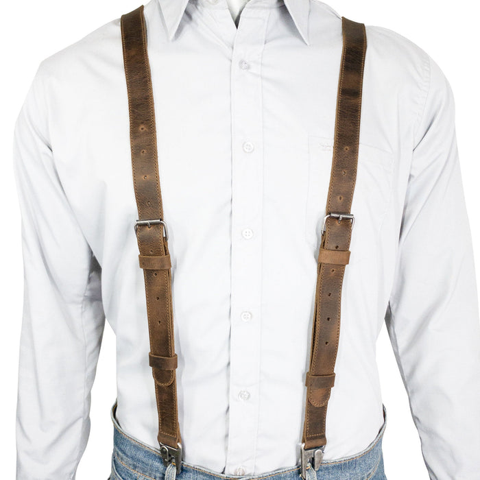 Model wearing Leather Y Back Formal Suspenders from Hide & Groom, highlighting how they fit over a shirt. These Full Grain Leather Y Back Formal Suspenders make a stylish Groom Accessory and provide reliable shoulder support for weddings and events. Each piece is handmade, ensuring quality and uniqueness from artisans.