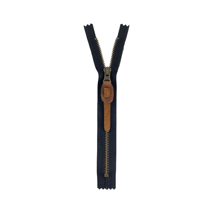 Rustic Zipper Pull Replacement by Hide & Drink with a sleek design, part of a set of 6. Ideal for use on backpacks, jackets, wallets, luggage, and bags, this full grain leather pull adds a touch of rustic elegance. Handmade with care, every piece is hand cut, hand sewn, and fire branded in La Antigua Guatemala & Oaxaca Mexico.