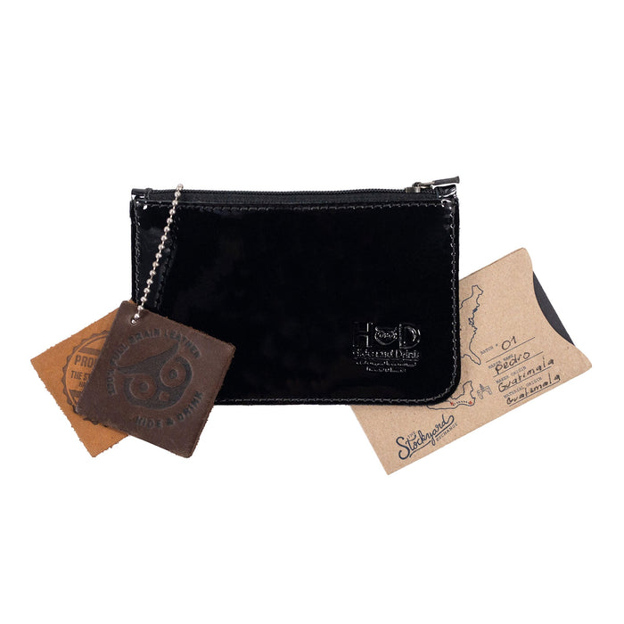 Hide & Drink Zippered Wallet alongside unique artisan creations, highlighting its value as an exquisite gift item. Made from premium full grain leather, this zippered wallet seamlessly integrates functionality as a card case and coin organizer, reflecting the craftsmanship of small batch production from La Antigua Guatemala & Oaxaca Mexico.